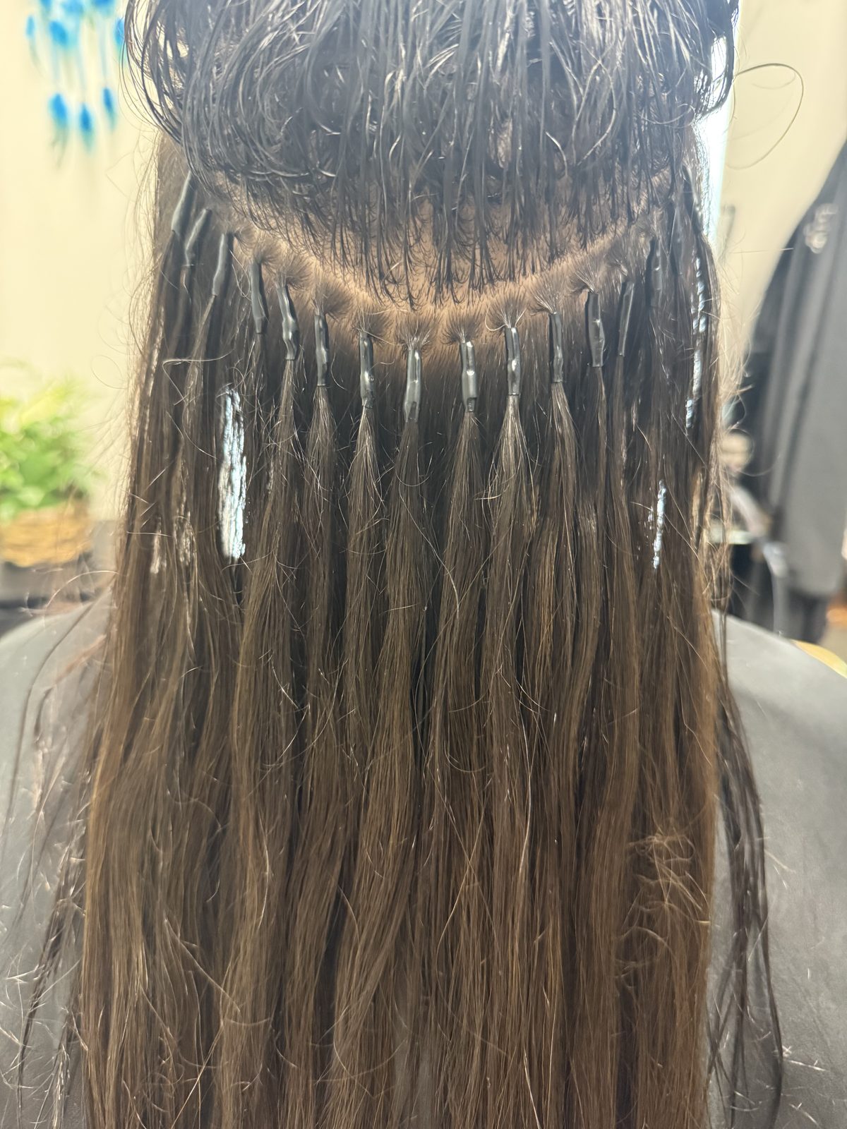 Close-up of individual I-tip strand placement