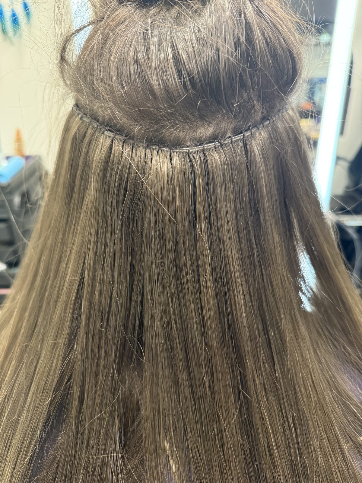 Close-up of a hand-tied weft install